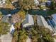 Aerial view of the home showing a metal roof, driveway, and the canal waterfront at 6291 Sebring St, Weeki Wachee, FL 34607