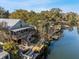 Aerial view of a waterfront home with a dock and decks leading to the canal at 6291 Sebring St, Weeki Wachee, FL 34607