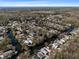 Aerial view of canal-front homes in a community surrounded by lush greenery, perfect for boating and waterfront living at 6291 Sebring St, Weeki Wachee, FL 34607