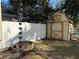 Backyard featuring a storage shed, rain chain and planting beds at 6291 Sebring St, Weeki Wachee, FL 34607
