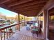 Spacious waterfront balcony featuring comfortable seating, scenic views and string lights for a cozy atmosphere at 6291 Sebring St, Weeki Wachee, FL 34607