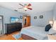 Serene bedroom with wood floors, a cozy bed, and a dark wood dresser at 6291 Sebring St, Weeki Wachee, FL 34607