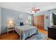 Serene bedroom with wood floors, a cozy bed, and ample natural light at 6291 Sebring St, Weeki Wachee, FL 34607
