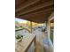 Large wooden deck offering seating, lake views, and an outdoor dining area for relaxing by the water at 6291 Sebring St, Weeki Wachee, FL 34607