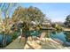 Inviting waterfront home with a private dock featuring cozy seating and stunning water views at 6291 Sebring St, Weeki Wachee, FL 34607