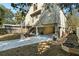 View of the exterior elevation and landscaping showcasing the stilt foundation at 6291 Sebring St, Weeki Wachee, FL 34607