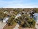 Aerial view of a charming home nestled among lush trees, showcasing its unique architectural style at 6291 Sebring St, Weeki Wachee, FL 34607