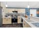 Charming kitchen with sleek appliances, ample counter space, and attractive tile backsplash at 6291 Sebring St, Weeki Wachee, FL 34607