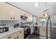 Well-lit kitchen with stainless steel appliances, white countertops, and a stylish backsplash at 6291 Sebring St, Weeki Wachee, FL 34607