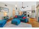 Cozy living room with hardwood floors, recessed lighting, and a comfortable blue sofa with red pillows at 6291 Sebring St, Weeki Wachee, FL 34607