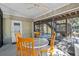 Charming screened-in porch with seating for four and beautiful views of the surrounding landscape at 6291 Sebring St, Weeki Wachee, FL 34607