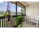 Relaxing balcony featuring outdoor seating and hanging plants with a view of the neighborhood at 6303 23Rd N St, St Petersburg, FL 33702