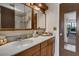 Bathroom boasts a single sink vanity, updated mirror cabinets, and a tiled shower and tub at 6303 23Rd N St, St Petersburg, FL 33702