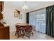 Cozy dining area with a wooden table, four chairs, and a charming chandelier at 6303 23Rd N St, St Petersburg, FL 33702