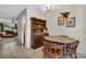Cozy dining area with a wooden table, four chairs, and a charming chandelier at 6303 23Rd N St, St Petersburg, FL 33702