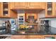 Modern kitchen features granite countertops, stainless steel appliances, and custom wood cabinetry at 6303 23Rd N St, St Petersburg, FL 33702