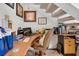 Cozy office space with built-in desk, shelves, and comfortable chair under the stairs at 6303 23Rd N St, St Petersburg, FL 33702