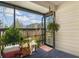 Enclosed back porch with dark carpet and view of surrounding landscape and neighborhood at 6303 23Rd N St, St Petersburg, FL 33702