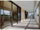 Spacious covered balcony featuring sliding glass doors and a scenic view at 6500 Sunset Way # 202, St Pete Beach, FL 33706