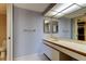 Bathroom with a vanity, mirror, and a separate toilet area at 6500 Sunset Way # 202, St Pete Beach, FL 33706
