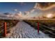 Scenic beach path leading to the sandy shores, perfect for a leisurely stroll at 6500 Sunset Way # 202, St Pete Beach, FL 33706