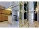 Bright condominium foyer featuring mirrored walls reflecting an eat-in breakfast nook, and an open floorplan at 6500 Sunset Way # 202, St Pete Beach, FL 33706
