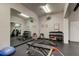Well-equipped community gym featuring weights, benches, exercise balls, and mirrors at 6500 Sunset Way # 202, St Pete Beach, FL 33706
