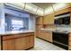 Kitchen features a breakfast bar with seating and is open to another room at 6500 Sunset Way # 202, St Pete Beach, FL 33706