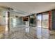 Large living room features mirrored walls and access to outdoor balconies at 6500 Sunset Way # 202, St Pete Beach, FL 33706