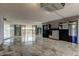 Spacious living room with tile floors and cabinetry and a large adjacent balcony at 6500 Sunset Way # 202, St Pete Beach, FL 33706