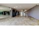 Large living room featuring tiled floors, mirrored accents, and sliding doors to the balcony at 6500 Sunset Way # 202, St Pete Beach, FL 33706