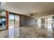 Spacious living room features large windows with an adjacent balcony at 6500 Sunset Way # 202, St Pete Beach, FL 33706