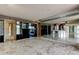 Spacious living room has tile floors, cabinetry, and large mirrored wall at 6500 Sunset Way # 202, St Pete Beach, FL 33706