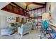 A bright condo lobby with modern furniture, high ceilings, and statement chandelier at 6500 Sunset Way # 202, St Pete Beach, FL 33706