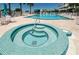 Outdoor pool and hot tub, a perfect spot for relaxing and enjoying the sunshine at 6500 Sunset Way # 202, St Pete Beach, FL 33706