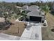 This single-story home is complete with a spacious driveway and perfectly manicured landscape with many trees at 920 Regal Manor Way, Sun City Center, FL 33573