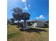 Beautiful home with a screened patio and well-maintained landscaping, offering great curb appeal at 920 Regal Manor Way, Sun City Center, FL 33573