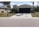 Charming single-story home with a well-manicured lawn and two-car garage, perfect for suburban living at 920 Regal Manor Way, Sun City Center, FL 33573