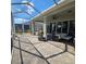 Enjoy outdoor living on the spacious screened patio, perfect for dining and lounging at 920 Regal Manor Way, Sun City Center, FL 33573