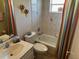 Charming bathroom featuring a tub with shower and a pedestal sink at 9350 Gulfstream, Englewood, FL 34224