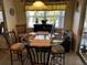 Cozy dining area with a glass-top table and comfortable seating at 9350 Gulfstream, Englewood, FL 34224