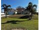 Attractive home featuring a well-manicured lawn and mature landscaping at 9350 Gulfstream, Englewood, FL 34224
