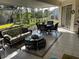 Bright and airy sunroom with tile flooring and comfortable seating at 9350 Gulfstream, Englewood, FL 34224