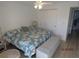Inviting bedroom showcasing a cozy bed, ample natural light, and contemporary decor at 1 Quails Run Blvd # 2, Englewood, FL 34223