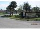 Welcoming 'Quail's Run' community sign surrounded by lush landscaping at 1 Quails Run Blvd # 2, Englewood, FL 34223