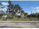 Scenic community view featuring well-maintained lawns and mature trees at 1 Quails Run Blvd # 2, Englewood, FL 34223