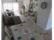 Relaxing dining area in the sunroom provides lovely outdoor views and adjoins the living room at 1 Quails Run Blvd # 2, Englewood, FL 34223
