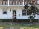 Charming condo featuring well-maintained landscaping, a cozy entryway, and a classic architectural design at 1 Quails Run Blvd # 2, Englewood, FL 34223