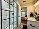 Renovated bathroom with a tiled glass shower, black fixtures, and modern vanity at 10118 66Th Ave, Seminole, FL 33772