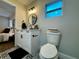 Bathroom featuring patterned tile floors, black fixtures, and a modern vanity at 10118 66Th Ave, Seminole, FL 33772